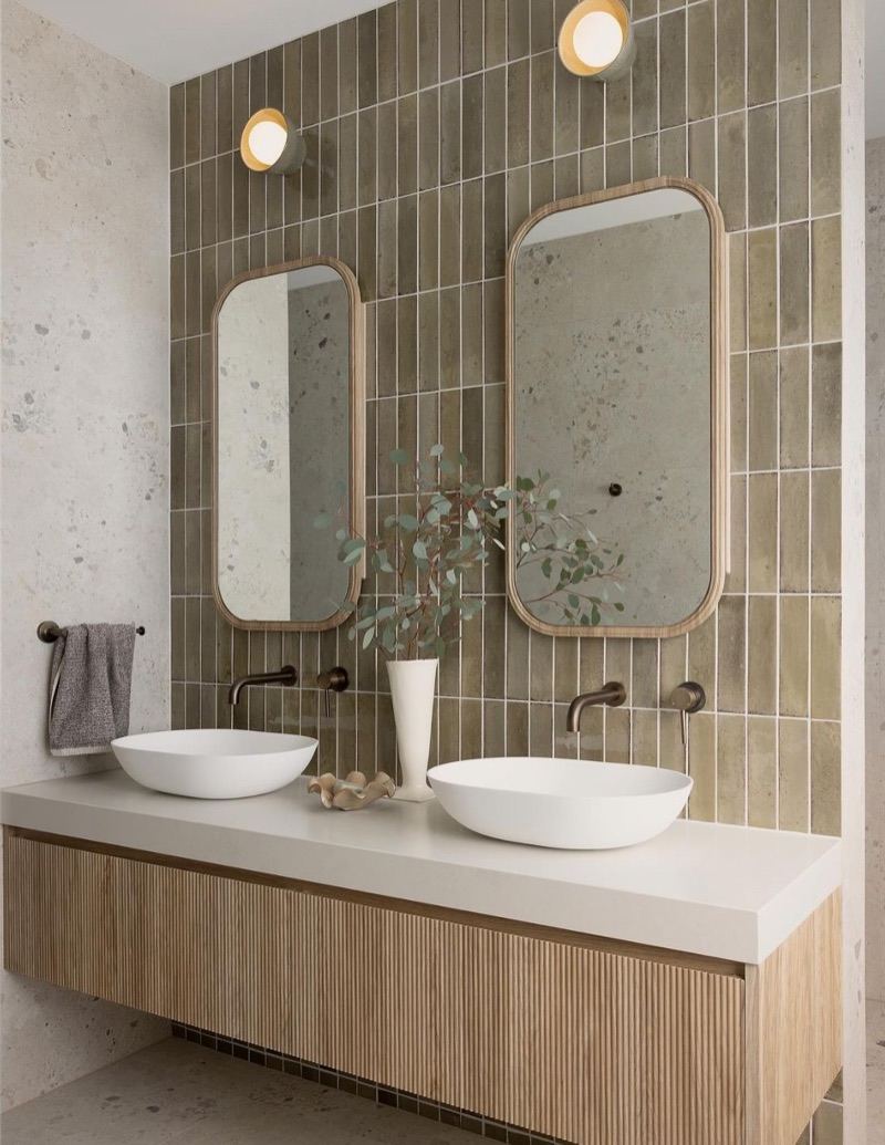 Floating bathroom vanity with fluted fronts and vessel sinks by Birch & Grain