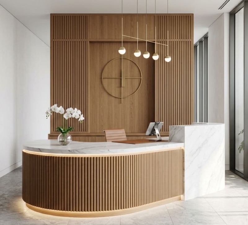 Curved fluted reception desk with backlit base and slatted feature wall